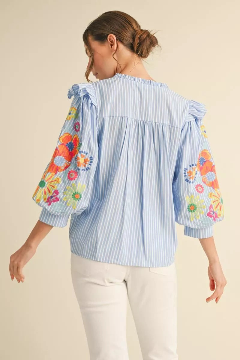 Beautiful Top with 3/4 puff sleeves and embroidered accents.