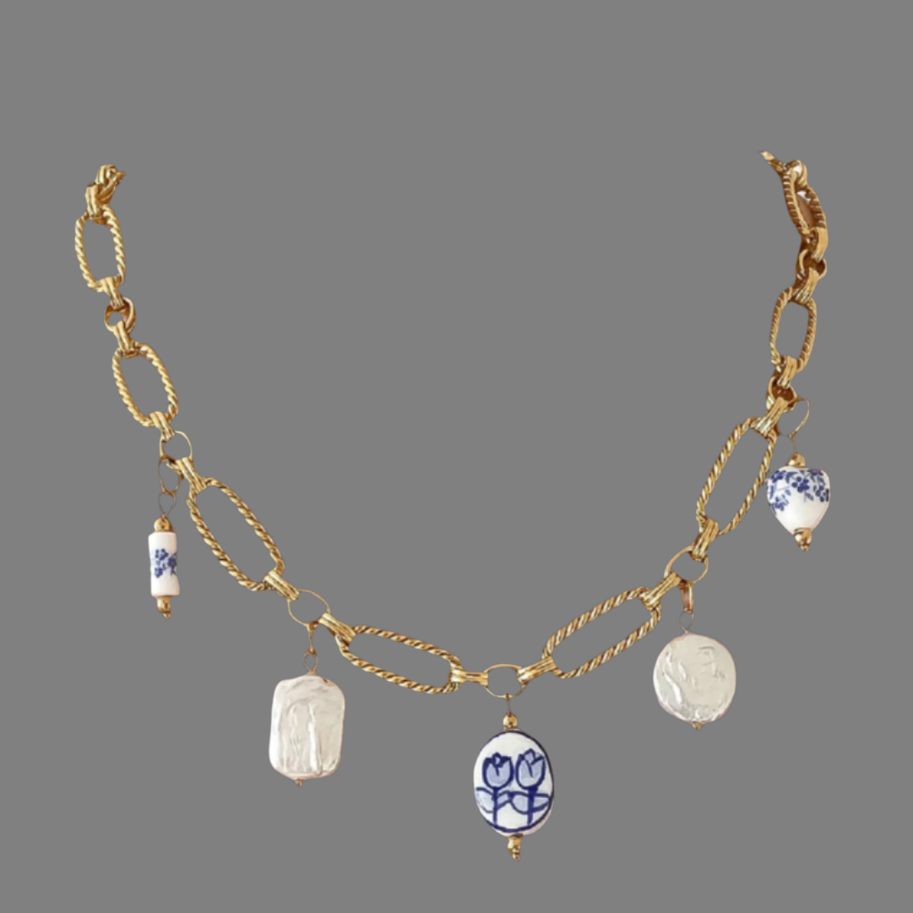 Riela-Blue Necklace with hand painted ceramic florals, with 18k plating gold.