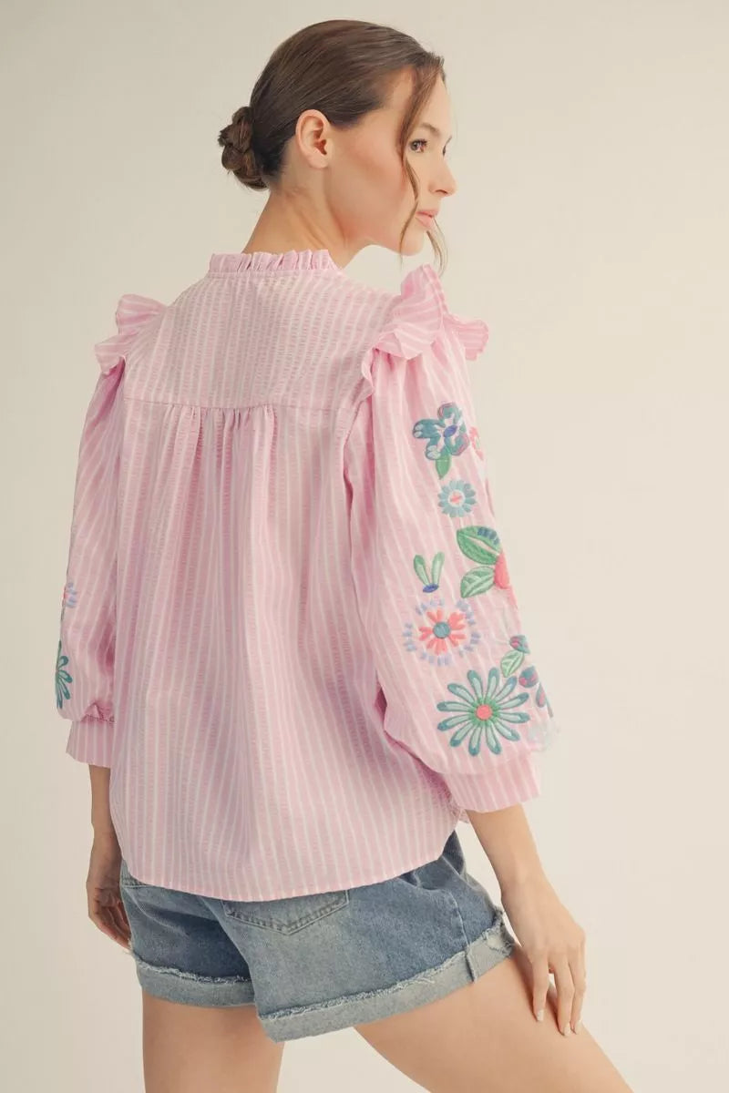 Beautiful Top with 3/4 puff sleeves and embroidered accents in Blue and Pink